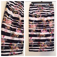Black and white striped skirt with floral pattern