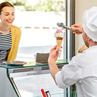 Man serving ice cream to a woman