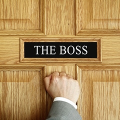 person knocks on boss' office door