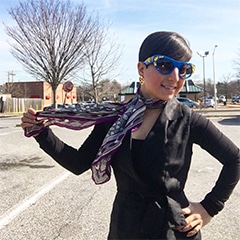 carolyn becker poses in spring time scarf and sunnies