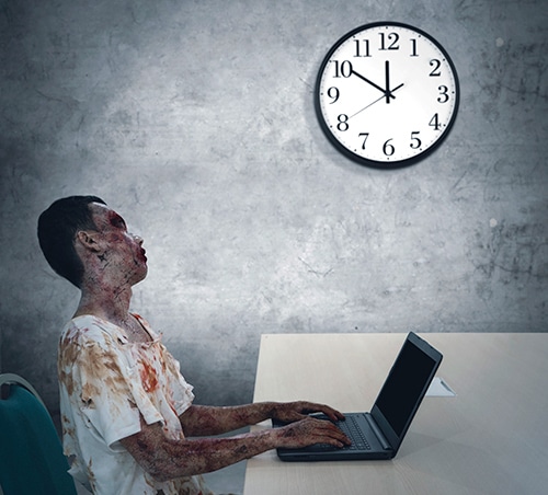 Zombie typing on laptop